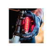 Lezyne Strip 150 rear bike light with alert mode, being installed on the bike, visible red LED lights for increased safety.