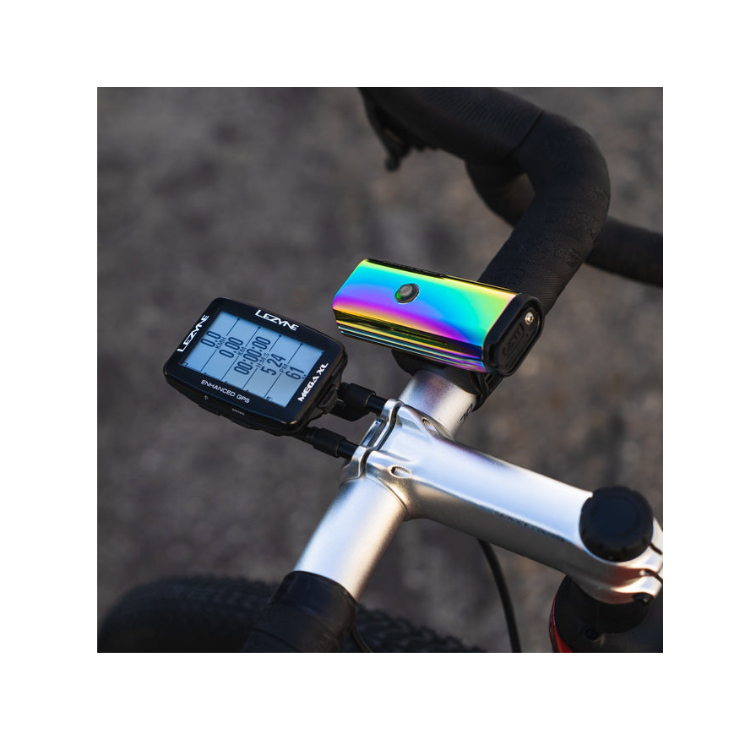 Lezyne Lite Drive 1000XL in vibrant rainbow finish, mounted on a bike handlebar alongside a Lezyne cycling computer, capturing a dynamic biking setup.