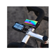 Lezyne Lite Drive 1000XL in vibrant rainbow finish, mounted on a bike handlebar alongside a Lezyne cycling computer, capturing a dynamic biking setup.