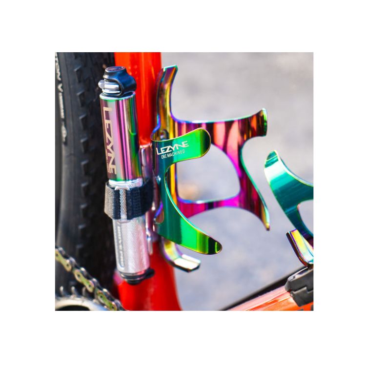 Lezyne CNC bottle cage and pump in oil slick finish mounted on a red bicycle frame.