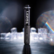 Lezyne Pocket Drive Pro in black displayed vertically with artistic lighting.