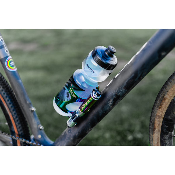 A Lezyne Pocket Drive Pro pump in oil-slick finish mounted on a bicycle frame next to a water bottle.
