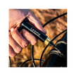 Cyclist using Lezyne Pocket Torque Drive tool to tighten bike handlebar bolt.