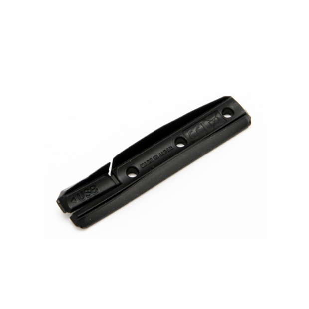 Black replacement USB mount cover for Lezyne Strip Drive lights with mounting holes.