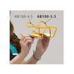 Comparison of yellow Minoura AB100-4.5 and AB100-5.5 bottle cages held side by side.