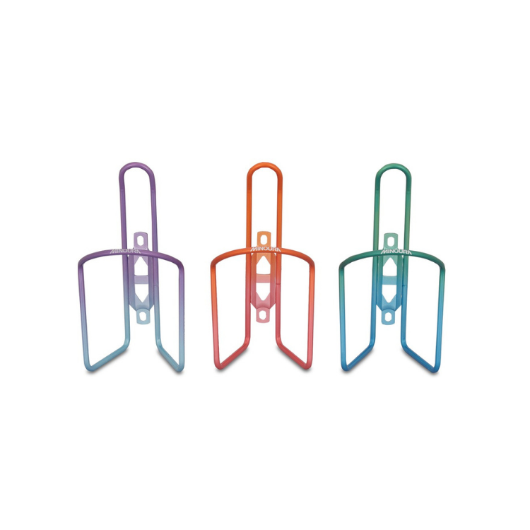 Three Minoura bottle cages in purple-blue, red-orange, and green-blue gradient, front-facing display.