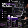 Panaracer Seal Smart EX sealant bottles with a person working on a bicycle tire in a workshop setting.