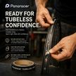 Person applying Panaracer tubeless tire tape with brand branding and product details.