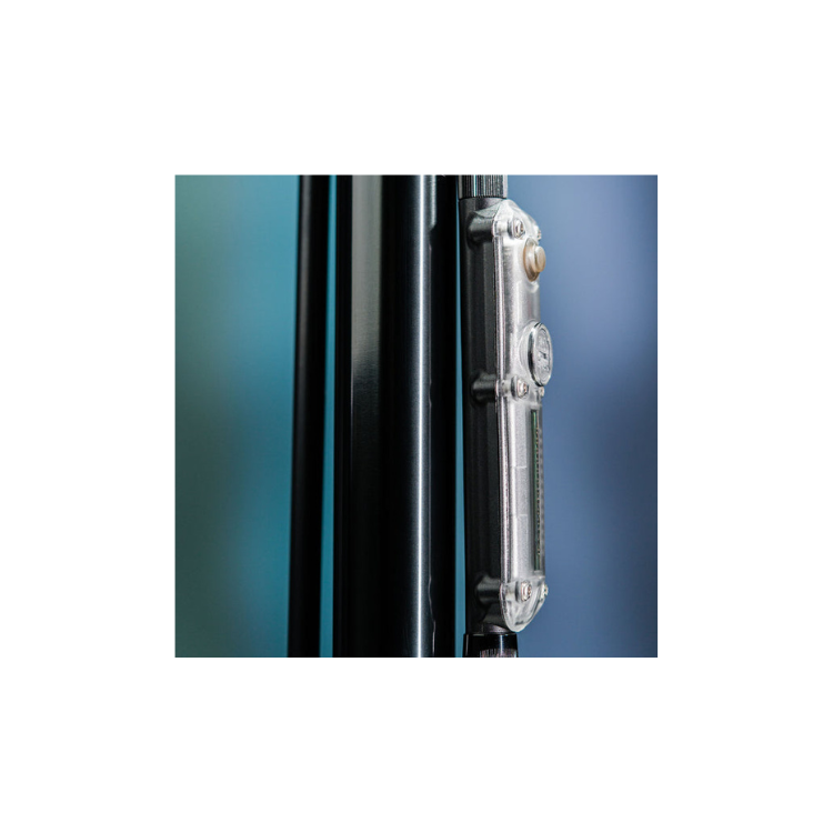 Full-length view of a slim floor pump barrel with integrated digital gauge for precise tire inflation.