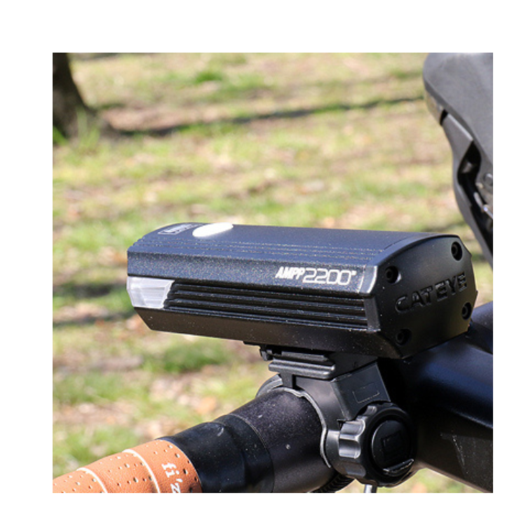 Cateye AMPP 2200 Front Light - High-power bike light mounted on the handlebar for enhanced night visibility and safety while cycling.
