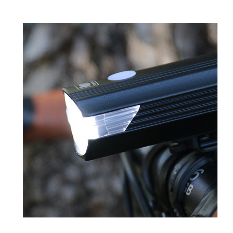 Cateye AMPP 2200 Front Light - Focused beam from Cateye AMPP 2200 providing strong light for night cycling in dark environments.