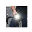 Sync Core Bicycle Front Light in Use - A cyclist adjusting the Sync Core front bike light for improved nighttime visibility and safety on the road.